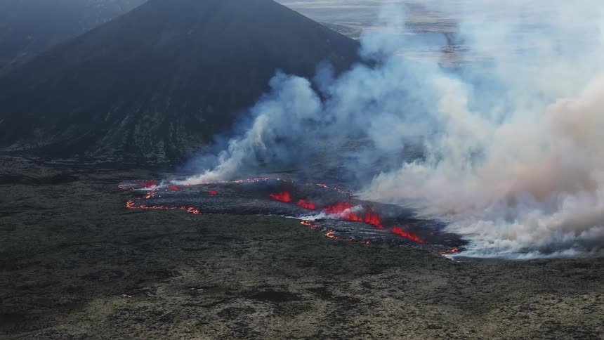 Aerial panorama of the ground burning from lava