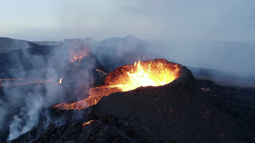 Aerial landscape of a volcano eruption on a mountainous area