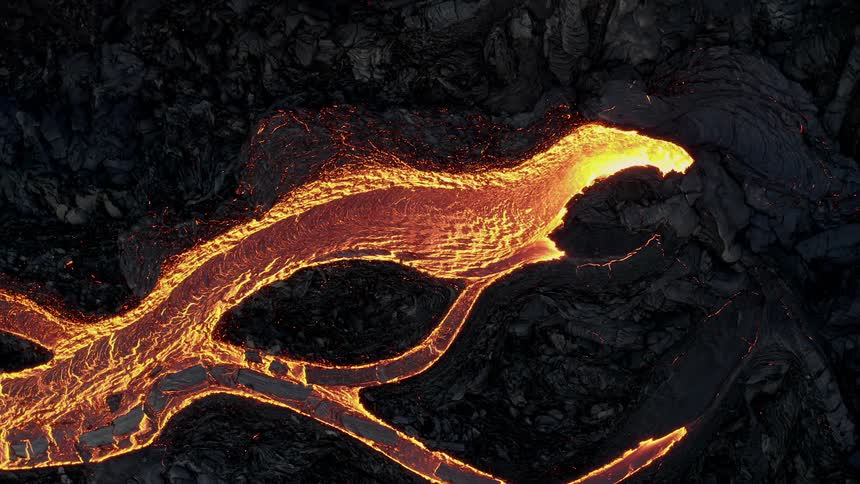 An aerial view of lava flowing