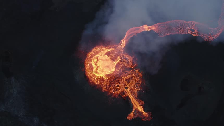 An erupting volcano spewing magma and lava