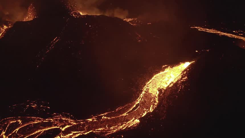 An aerial view captures the dramatic sight of valcona lavas erupting showcasing the raw power and intensity of volcanic activity from above