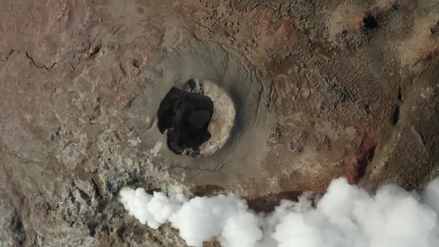 Aerial view of the ground emitting smoke