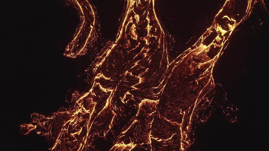 Aerial view molten lava river stream at night