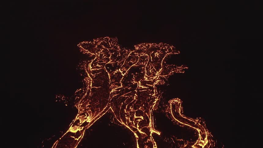 A stone floor with lots of lava and glowing magma