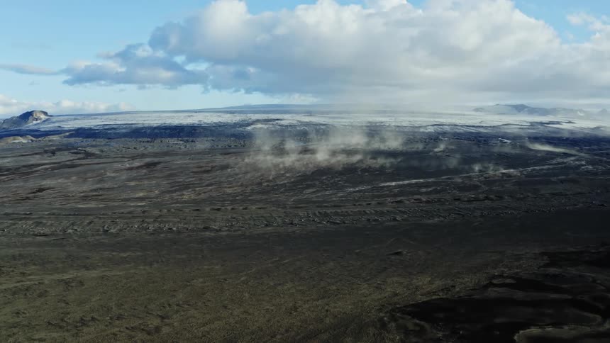 Aerial view of sand rising from the ground in the plains