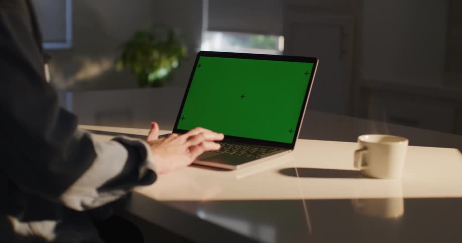 Hand of a woman typing on her laptop on the table