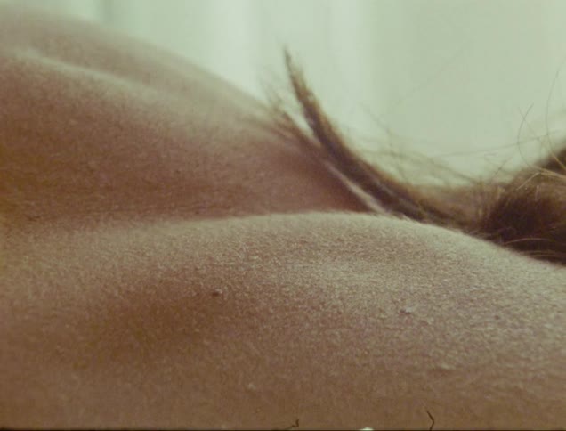 A close up shot of a womans naked back