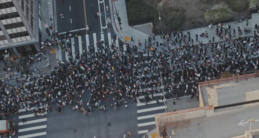 Crowd walking through the city streets