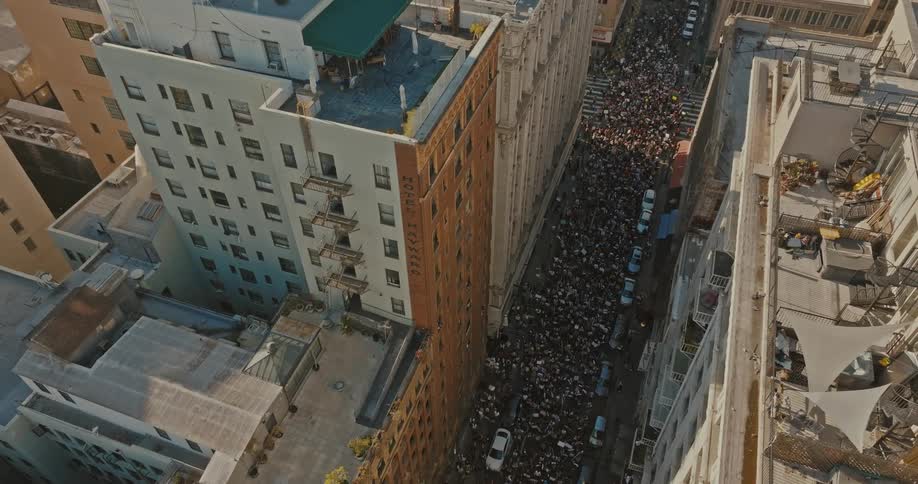 Crowd manifesting through the streets of a metropolis