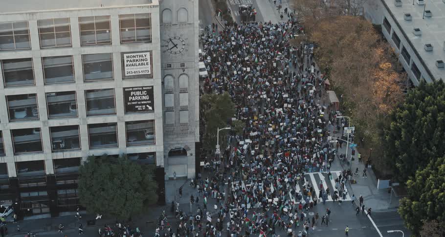 Aerial view of a crowd of people protesting in the city streets