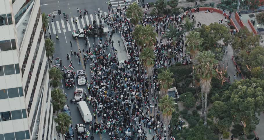 Aerial panorama of a crowd in a square in the midst of the city demonstrating
