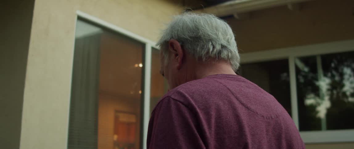 Elderly man standing in front of the house with a confused expression looking around