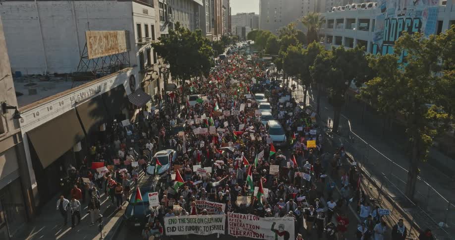Aerial view of a crowd of people protesting in the city streets