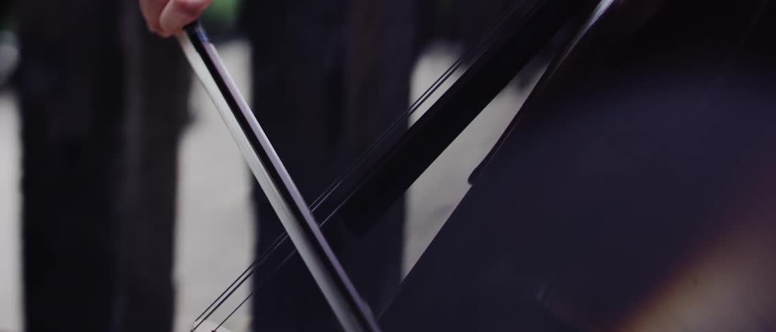 Closeup of a womans hands playing the violin