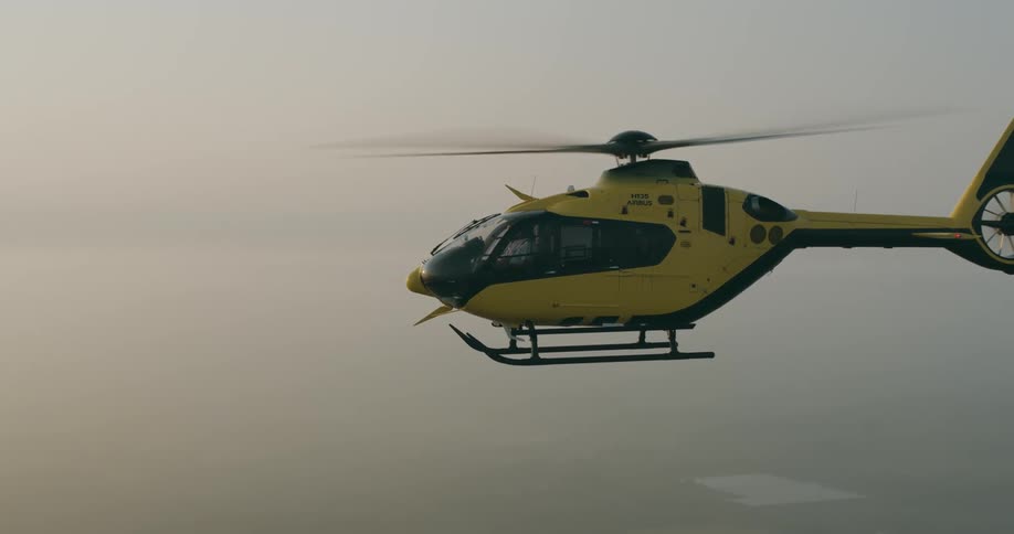Helicopter flying through the sky in the morning
