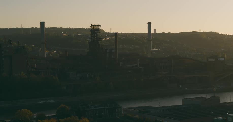 Aerial of a factory in the city during the early hours of the morning