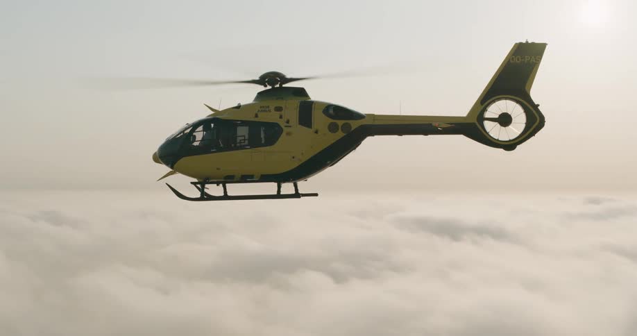 Eurocopter ec135 light utility helicopter flying in the sky