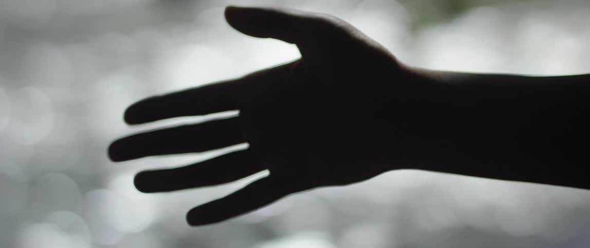 A person making gentle movements with their hand