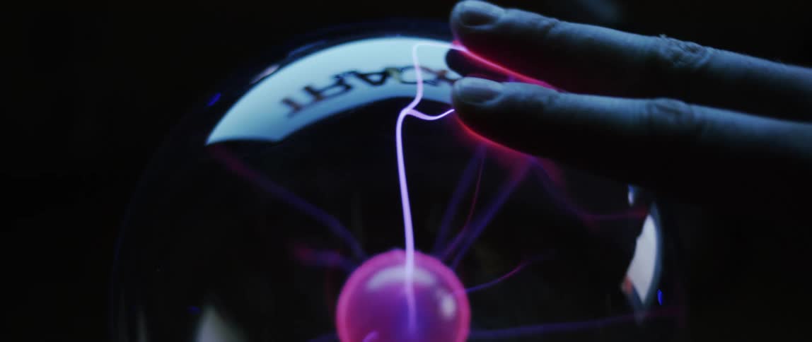 A person baking their hand into an energy sphere