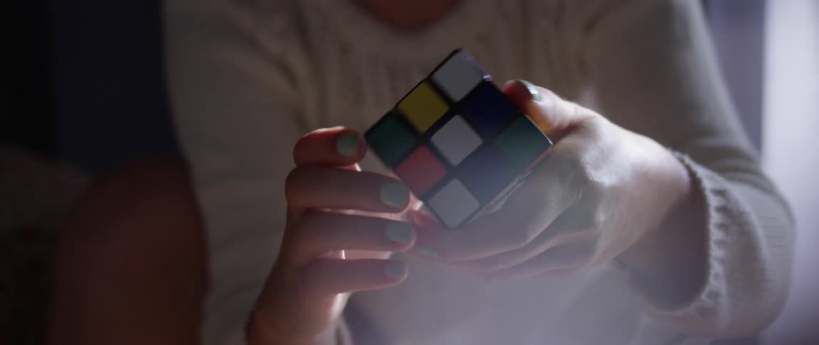 A person spinning a rubiks cube