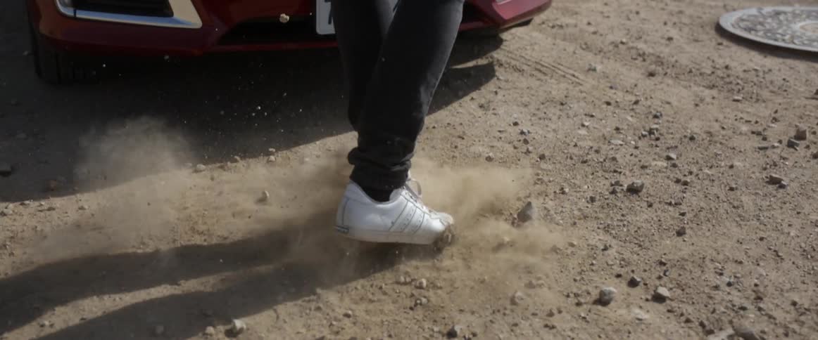 A person runs toward their car