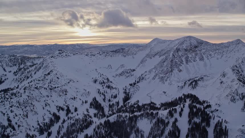 Aerial of a glacial mountain as the sun sets