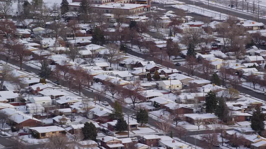 Aerial view of snowy suburban area in the city