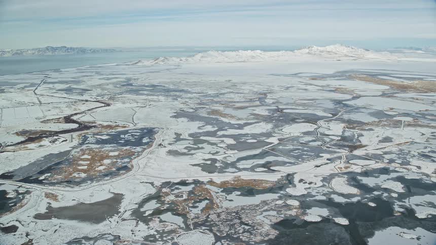 Aerial view of the snowcovered ground by the seaside