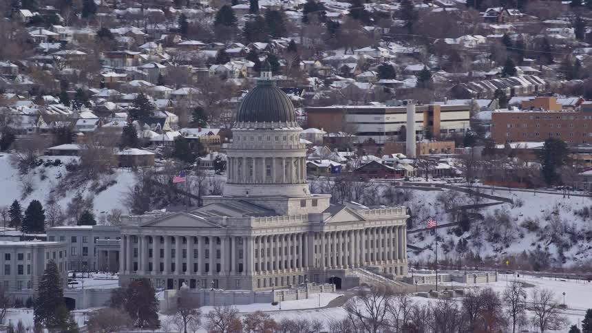 Aerial view of a congress in the midst of an urban city covered in snow