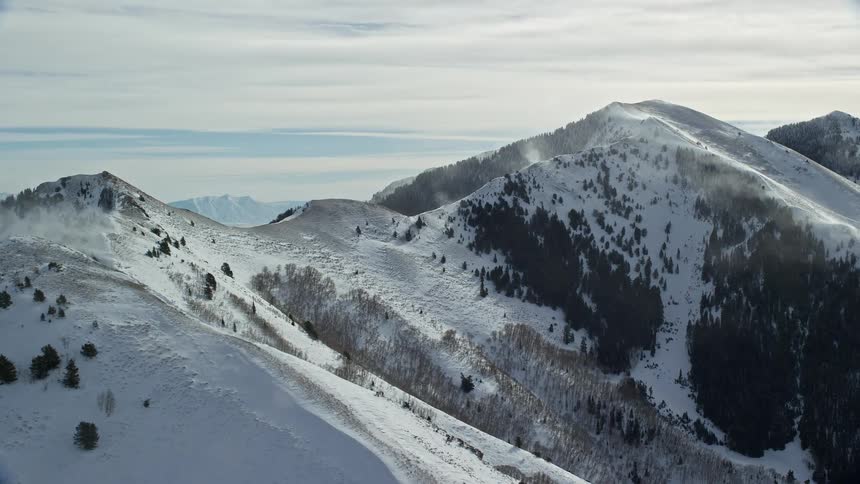 Skyline of a mountain with snow during winter on a sunny morning