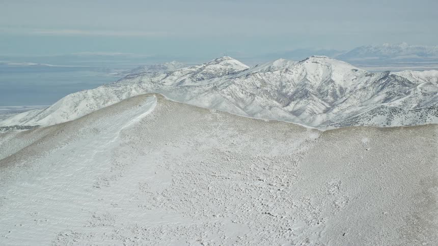 Aerial panorama of mountains and peaks covered in snow