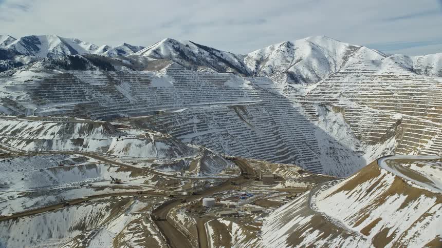 Aerial view of mountains and peaks covered in snow in a stone quarry