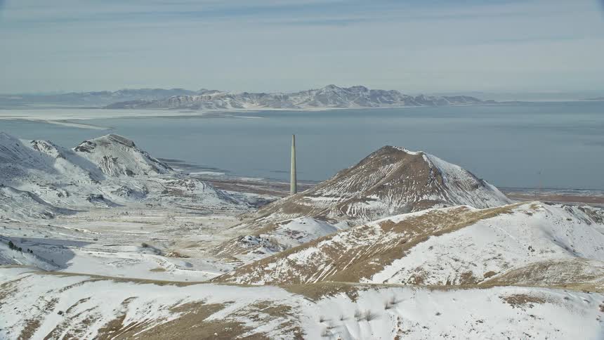 Snowcovered hills with frozen water beaches during winter