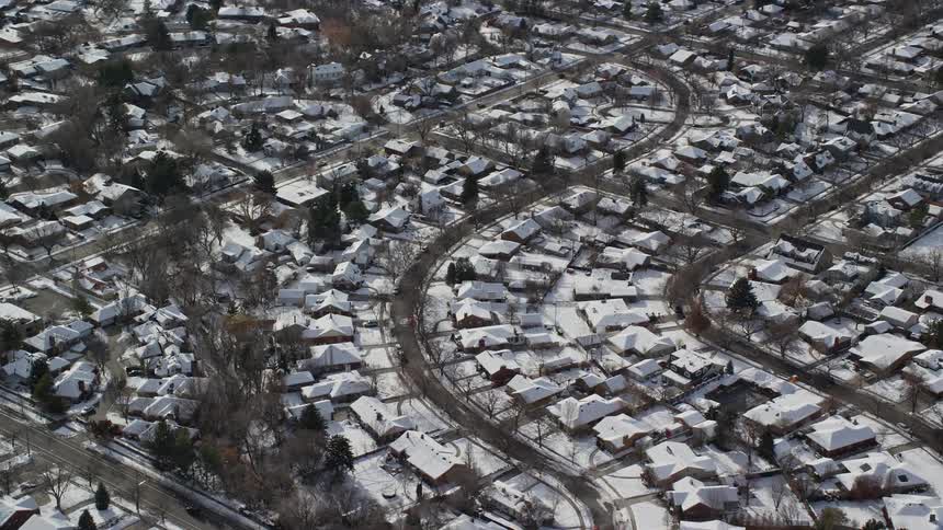 Aerial of a snow covered suburbia neighborhood
