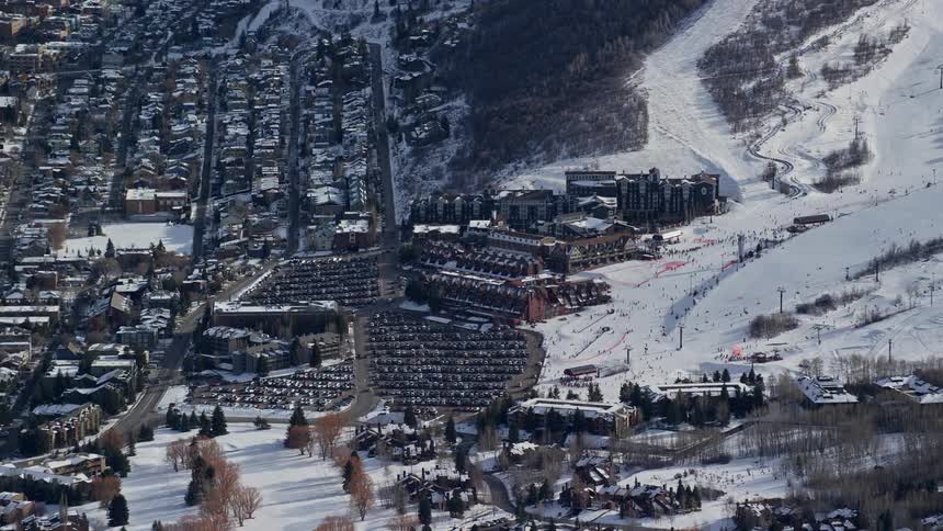 Aerial of a city with a ski slope in harsh winter