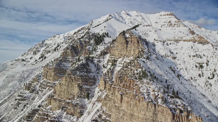 Aerial of rocky hills covered in snow during winter