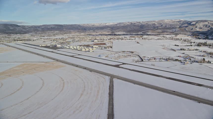 Skyline of an airport in a small rural town covered in snow