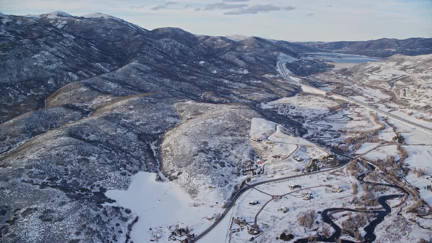 Panorama of mountains rivers in a natural environment covered in snow