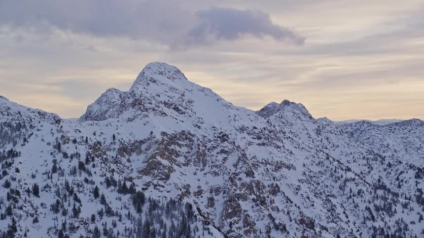 An aerial view of a snowcovered mountain range