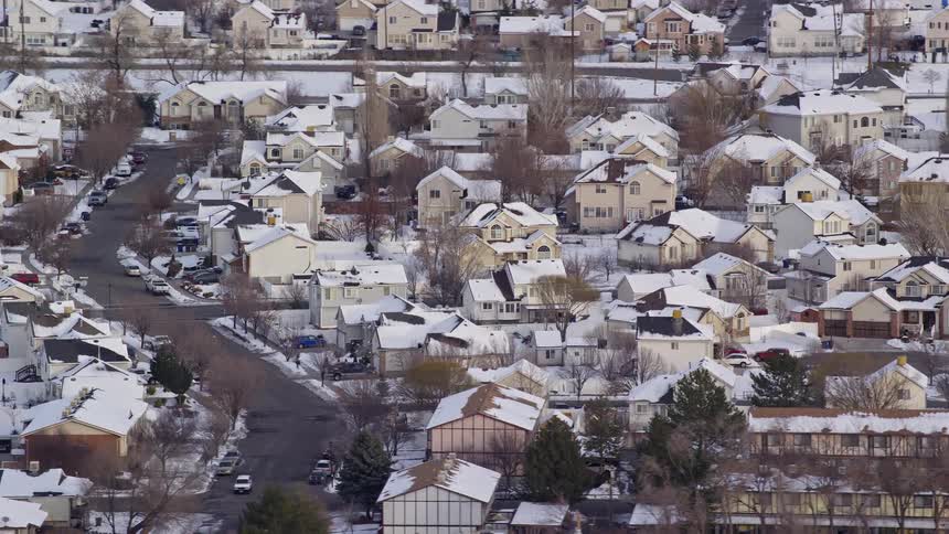 Aerial view of snowy suburban area in the city