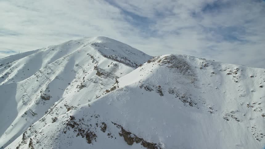 Rocky mountain peak with snow during winter