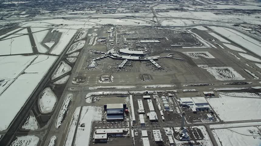 The airport is covered in snow