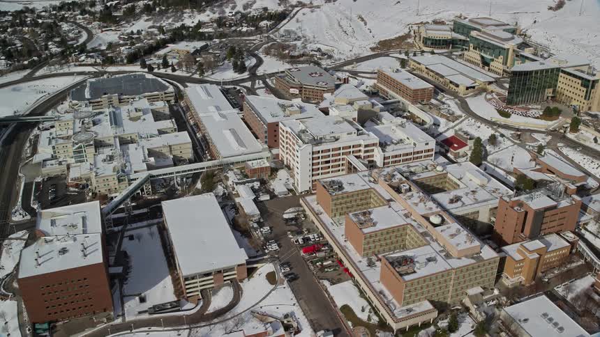 Aerial panorama of an urban city with buildings covered in snow
