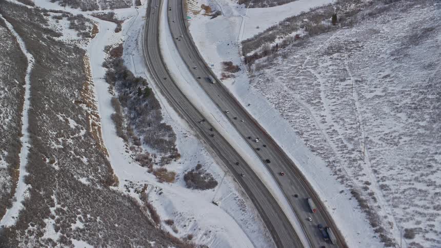 Aerial view of highway with calm traffic during winter days