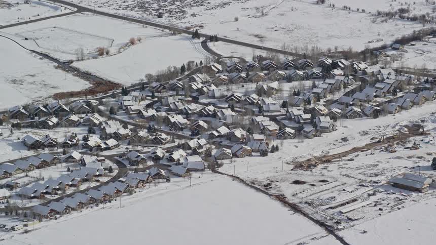 Aerial panorama of a residential neighborhood covered in snow