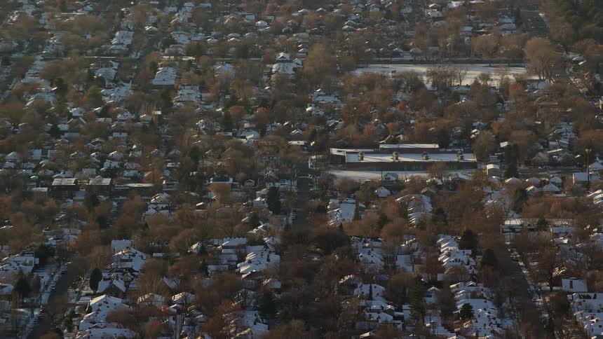 Aerial panorama of a residential neighborhood covered in snow