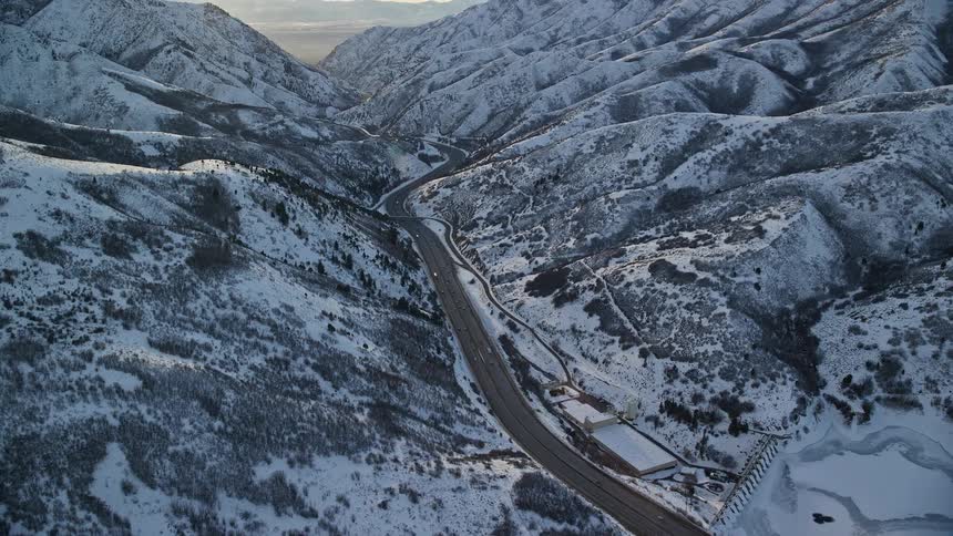 Aerial panorama of roads winding through snowcovered mountains