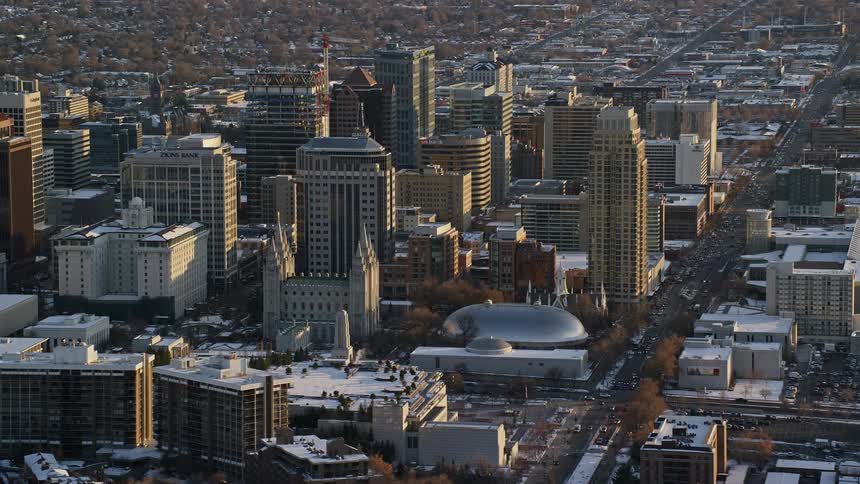Snow remains on ground and roofs of city during the winter
