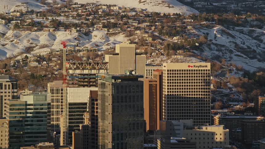 Aerial of a monastery on top of a snowcovered mountain