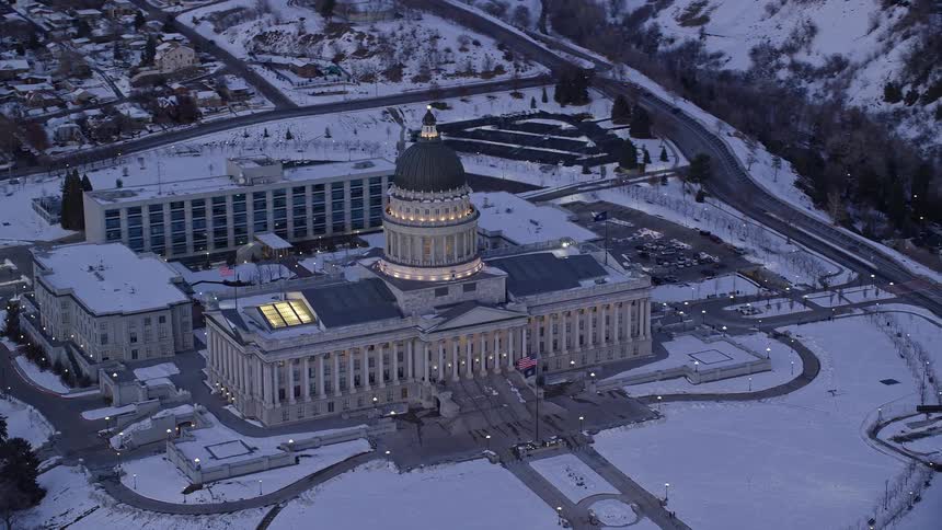 A building with ancient architecture and a dome on top in a region with snow on the ground